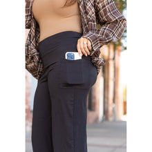 Load image into Gallery viewer, High-waisted black wide leg pants with pockets by Julia Rose, Julia Rose women’s wide leg pants lifestyle image