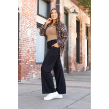 Load image into Gallery viewer, High-waisted black wide leg pants with pockets by Julia Rose, Julia Rose women’s wide leg pants lifestyle image
