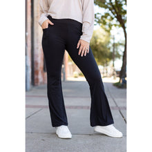 Load image into Gallery viewer, High-waisted black bootcut leggings by Julia Rose, Julia Rose women’s flared black leggings lifestyle image