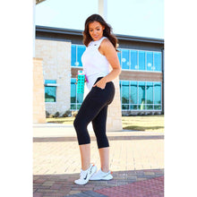 Load image into Gallery viewer, Julia Rose The Cassandra black capri leggings with pockets, Women wearing black capri pocket leggings