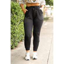 Load image into Gallery viewer, Women’s fleece-lined black joggers winter loungewear Soft black joggers with tapered leg and drawstring waist
