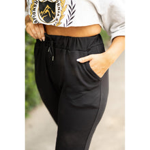 Load image into Gallery viewer, Women’s fleece-lined black joggers winter loungewear Soft black joggers with tapered leg and drawstring waist