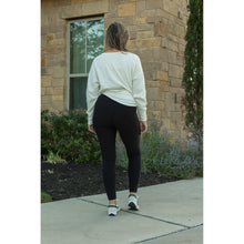 Load image into Gallery viewer, Soft black fleece-lined leggings with full length fit and pockets