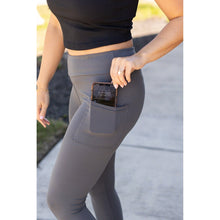 Load image into Gallery viewer, Julia Rose The Dani charcoal capri leggings with pockets, Women wearing charcoal capri pocket leggings