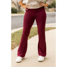 Load image into Gallery viewer, High-waisted maroon bootcut leggings with pockets by Julia Rose, Julia Rose women’s maroon flared leggings lifestyle image