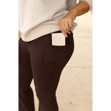 Load image into Gallery viewer, High-waisted brown bootcut leggings with pockets by Julia Rose, Julia Rose women’s brown flared leggings lifestyle image