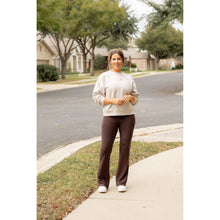 Load image into Gallery viewer, High-waisted brown bootcut leggings with pockets by Julia Rose, Julia Rose women’s brown flared leggings lifestyle image