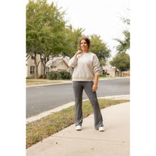 Load image into Gallery viewer, High-waisted charcoal bootcut leggings with pockets by Julia Rose, Julia Rose women’s charcoal flared leggings lifestyle image