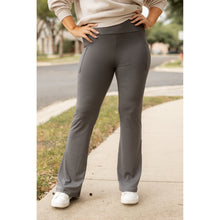 Load image into Gallery viewer, High-waisted charcoal bootcut leggings with pockets by Julia Rose, Julia Rose women’s charcoal flared leggings lifestyle image