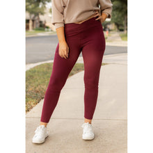 Load image into Gallery viewer, High-waisted maroon crossover leggings with pockets by Julia Rose, Julia Rose women’s maroon full length leggings lifestyle image