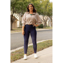 Load image into Gallery viewer, High-waisted navy crossover leggings with pockets by Julia Rose, Julia Rose women’s navy full length leggings lifestyle image