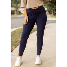 Load image into Gallery viewer, High-waisted navy crossover leggings with pockets by Julia Rose, Julia Rose women’s navy full length leggings lifestyle image