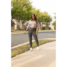 Load image into Gallery viewer, High-waisted charcoal crossover leggings with pockets by Julia Rose, Julia Rose women’s charcoal full length leggings lifestyle image