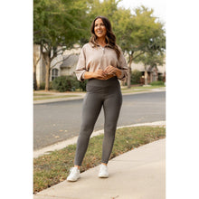 Load image into Gallery viewer, High-waisted charcoal crossover leggings with pockets by Julia Rose, Julia Rose women’s charcoal full length leggings lifestyle image