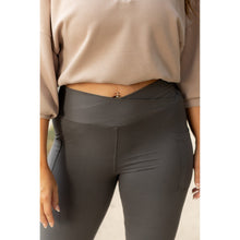 Load image into Gallery viewer, High-waisted charcoal crossover leggings with pockets by Julia Rose, Julia Rose women’s charcoal full length leggings lifestyle image