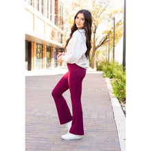 Load image into Gallery viewer, High-waisted maroon bootcut leggings with pockets by Julia Rose, Julia Rose women’s maroon flared leggings lifestyle image