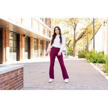 Load image into Gallery viewer, High-waisted maroon bootcut leggings with pockets by Julia Rose, Julia Rose women’s maroon flared leggings lifestyle image