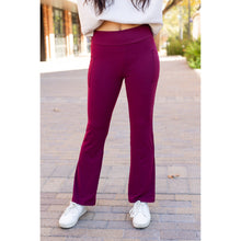 Load image into Gallery viewer, High-waisted maroon bootcut leggings with pockets by Julia Rose, Julia Rose women’s maroon flared leggings lifestyle image