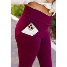 Load image into Gallery viewer, High-waisted maroon crossover leggings with pockets by Julia Rose, Julia Rose women’s maroon full length leggings lifestyle image