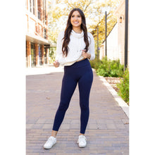 Load image into Gallery viewer, High-waisted navy crossover leggings with pockets by Julia Rose, Julia Rose women’s navy full length leggings lifestyle image