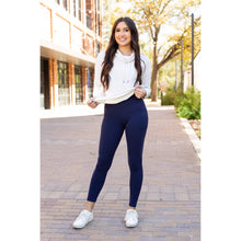 Load image into Gallery viewer, High-waisted navy crossover leggings with pockets by Julia Rose, Julia Rose women’s navy full length leggings lifestyle image