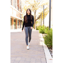 Load image into Gallery viewer, High-waisted charcoal crossover leggings with pockets by Julia Rose, Julia Rose women’s charcoal full length leggings lifestyle image