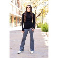Load image into Gallery viewer, High-waisted charcoal bootcut leggings with pockets by Julia Rose, Julia Rose women’s charcoal flared leggings lifestyle image