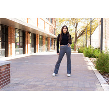 Load image into Gallery viewer, High-waisted charcoal bootcut leggings with pockets by Julia Rose, Julia Rose women’s charcoal flared leggings lifestyle image