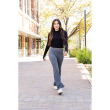 Load image into Gallery viewer, High-waisted charcoal bootcut leggings with pockets by Julia Rose, Julia Rose women’s charcoal flared leggings lifestyle image