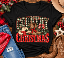 Load image into Gallery viewer, Country Christmas graphic tee with green plaid lettering, red polka dots, cowboy boots, western hat and festive Christmas bows.