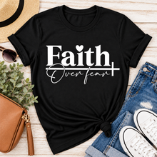 Load image into Gallery viewer, Faith Over Fear Christian inspirational graphic apparel featuring bold white Faith lettering, elegant Over Fear script, a small heart, and a cross design. Available in red and black in short sleeve crewneck, long sleeve crewneck, crewneck sweatshirt, and hoodie styles. Faith-based graphic clothing for women, everyday wear, church outfits, and inspirational gifts.