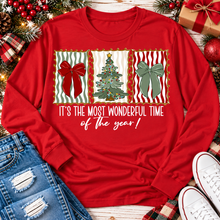 Load image into Gallery viewer, Red long sleeve Christmas shirt with festive bows, Christmas tree and It's the Most Wonderful Time of the Year graphic.