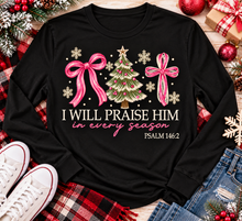 Load image into Gallery viewer, Christian Christmas shirt featuring I Will Praise Him in Every Season Psalm 146:2 graphic with pink bows, decorated Christmas tree, and cream snowflakes.
