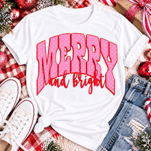 Load image into Gallery viewer, Merry and Bright Christmas graphic apparel with oversized pink polka dot lettering and festive holiday design