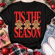 Load image into Gallery viewer, Tis the Season Christmas graphic apparel featuring red polka dot lettering and three gingerbread cookies