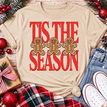 Load image into Gallery viewer, Tis the Season Christmas graphic apparel featuring red polka dot lettering and three gingerbread cookies