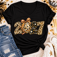 Load image into Gallery viewer, Black 2027 New Year's graphic apparel featuring leopard print numbers, a gold disco ball with an oversized glittery bow, black and gold stars, and sparkling accents. Available in crewneck tee, V-neck tee, sweatshirt, and hoodie styles.
