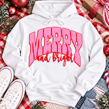 Load image into Gallery viewer, Merry and Bright Christmas graphic apparel with oversized pink polka dot lettering and festive holiday design