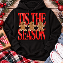 Load image into Gallery viewer, Tis the Season Christmas graphic apparel featuring red polka dot lettering and three gingerbread cookies