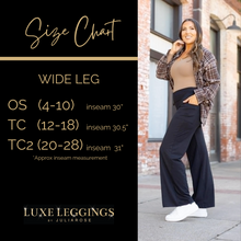 Load image into Gallery viewer, High-waisted black wide leg pants with pockets by Julia Rose, Julia Rose women’s wide leg pants lifestyle image