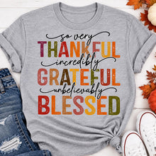 Load image into Gallery viewer, Thankful Grateful Blessed fall graphic crewneck tee with colorful autumn lettering
