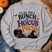 Load image into Gallery viewer, Hocus Pocus Halloween graphic long sleeve tee with cauldron, witch hat and spell books
