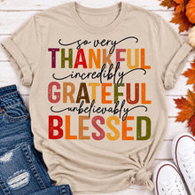 Load image into Gallery viewer, Thankful Grateful Blessed fall graphic crewneck tee with colorful autumn lettering
