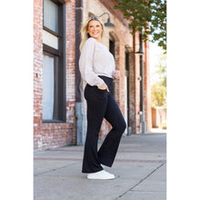 Load image into Gallery viewer, High-waisted black bootcut leggings by Julia Rose, Julia Rose women’s flared black leggings lifestyle image
