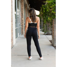 Load image into Gallery viewer, Women’s black leggings with zebra print panels  Stretchy leggings withflattering fit"
