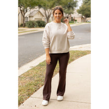 Load image into Gallery viewer, High-waisted brown bootcut leggings with pockets by Julia Rose, Julia Rose women’s brown flared leggings lifestyle image
