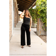 Load image into Gallery viewer, Women’s flowy velvet wide leg holiday pants. Velvet wide leg trousers styled for holiday outfits
