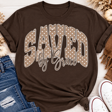 Load image into Gallery viewer, Saved by Grace faith graphic apparel with polka dot lettering, available in brown, navy and black V-neck, long sleeve, crewneck and hoodie styles.
