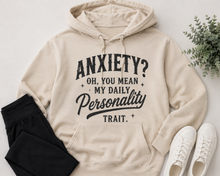 Load image into Gallery viewer, Cream hoodie with black vintage-style lettering reading Anxiety? Oh, You Mean My Daily Personality Trait.
