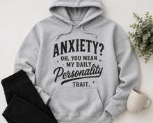 Load image into Gallery viewer, Grey hoodie with black vintage-style lettering reading Anxiety? Oh, You Mean My Daily Personality Trait.
